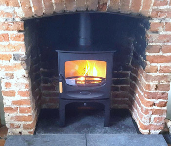Charnwood C5 Woodburner - with store stand in black. Installed near East Horsley near Leatherhead, Surrey